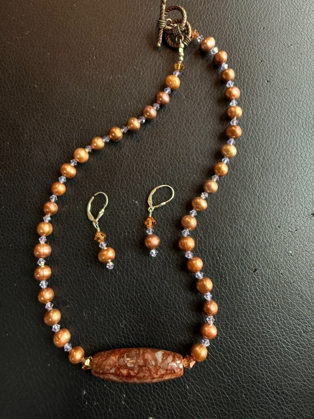 Polished granite necklace with copper colored beads